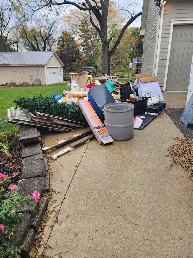 Dumpster being loaded with debris for 3 Yard Dumpster Rental in Wyckoff